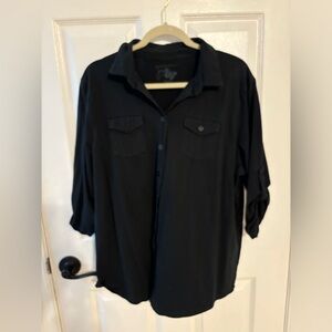 Short sleeve button down black top.